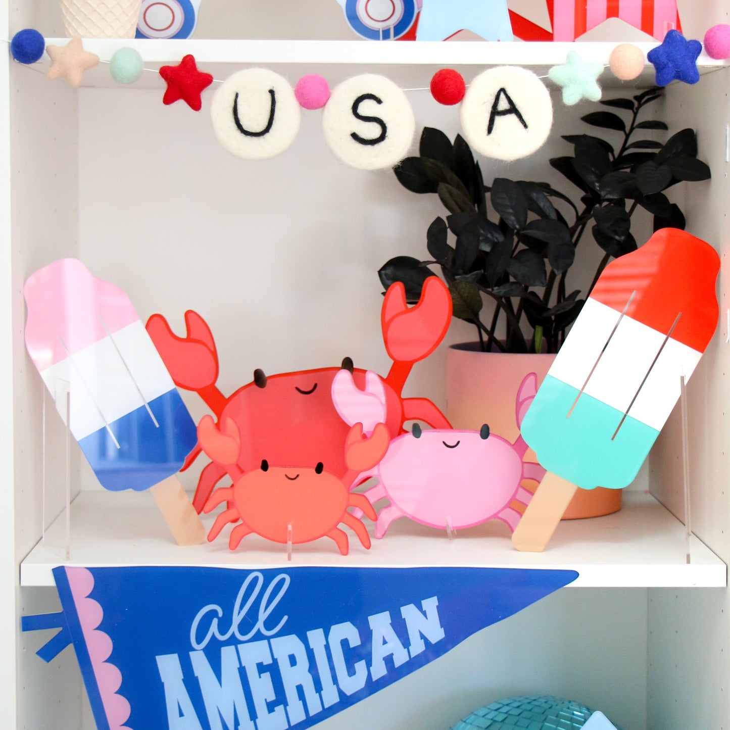 Red and turquoise rocket popsicle acrylic decor